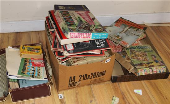 A suitcase of mixed ephemera, magazines, railway puzzles, a Thunderbirds Are Go magazine and game etc